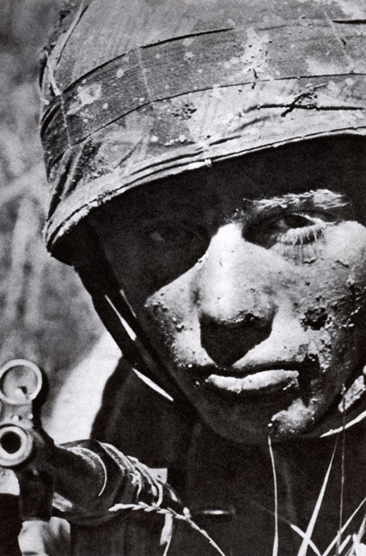 A Fallschirmjager german paratrooper face covered with mud and grime, Crete, 1941