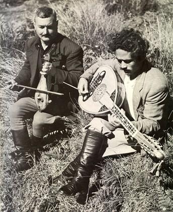 Cretan musicians playing the lyra and the lute.