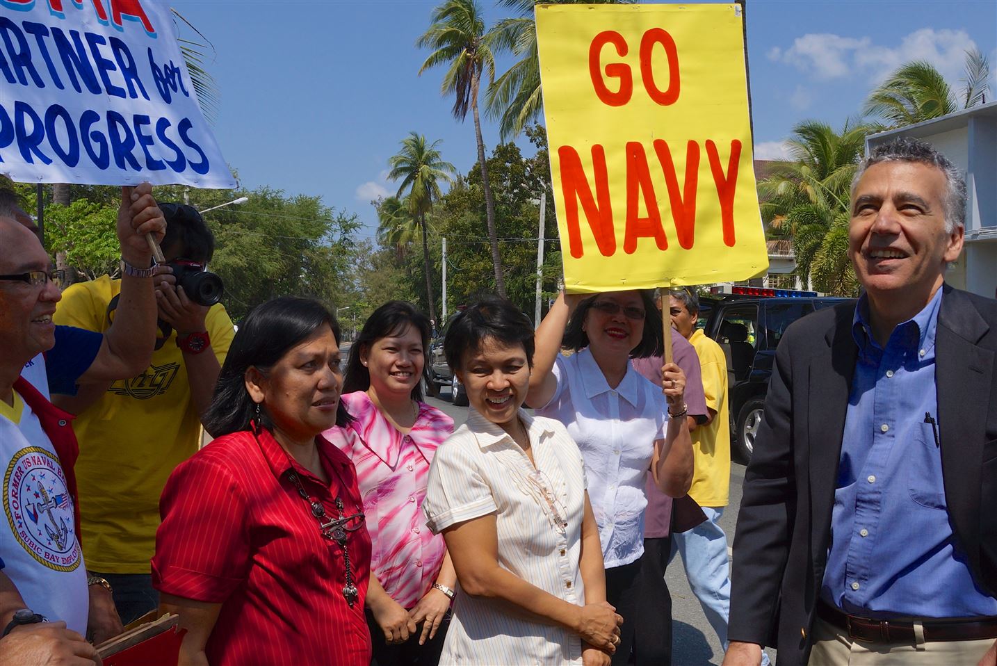 US Ambassador Philip S. Goldberg approaches a group of former US Naval Base employees who surprised him with a welcome rally during his visit to the Subic Bay Freeport, a former US military base.